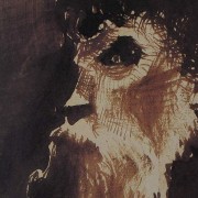 Ce détail d'un dessin de Victor Hugo représente le visage tourmenté d'un homme barbu.