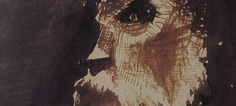 Ce détail d'un dessin de Victor Hugo représente le visage tourmenté d'un homme barbu.